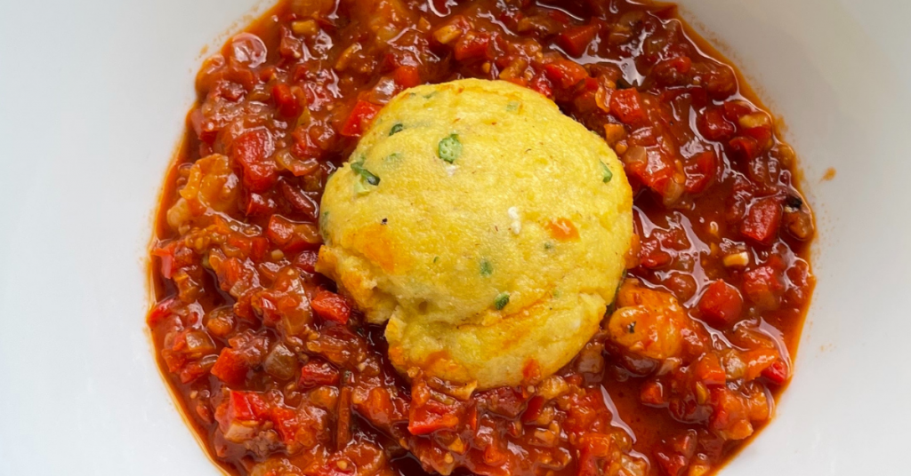 Recipes 4 a red stew with a ball of cornmeal flecked with okra in the middle